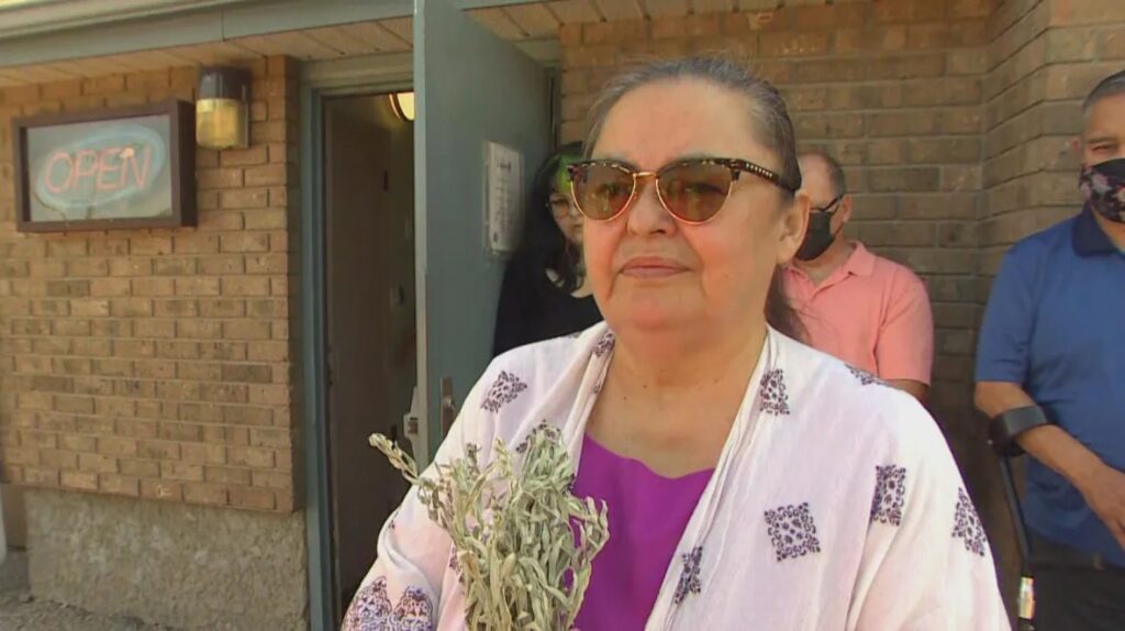 Victoria McIntosh, who says she was assaulted by Masse more than 50 years ago, stands outside the Powerview, Man., court on Wednesday. She said she'll be at every court hearing and hopes to speak directly to Masse. (Radio-Canada)