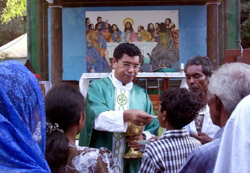 Bishop Belo during Friday morning mass in Dili, East Timor, on October 8, 1999. Belo returned to Timor-Leste on October 6 after being in exile due to the violence in Dili. He saw his house destroyed by fire and religious artifacts desecrated by pro-Jakarta militias © Jason Reed / Reuters