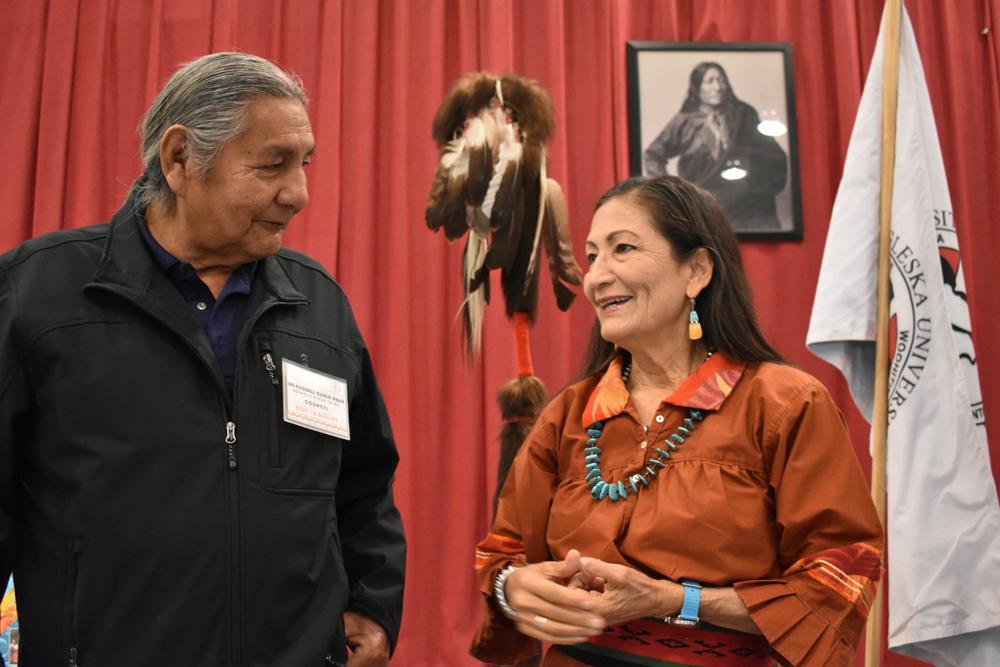Russell Eagle Bear, with the Rosebud Sioux Reservation Tribal Council, talks to U.S. Interior Secretary Deb Haaland during a meeting about Native American boarding schools at Sinte Gleska University in Mission, S.D., Saturday, Oct. 15, 2022. Haaland has been holding events across the nation to shed light on the abuse suffered by many Native American children forced to attend the government-backed schools. (AP Photo/Matthew Brown)