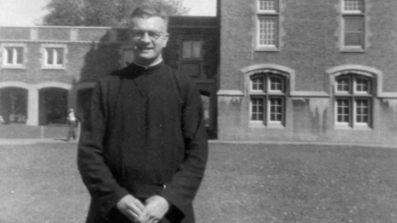 Fr. George Epoch is seen standing in the quad of Montreal's Loyola High School around 1957. Two of Epoch's former students say he inappropriately touched them during their preparatory year in 1957-58. (Submitted by Dorio Lucich)