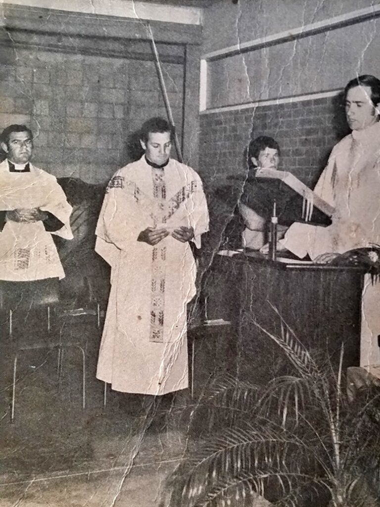 Father David Lancini (second from left) attends a service with Father Neville Creen on far left.(Supplied)