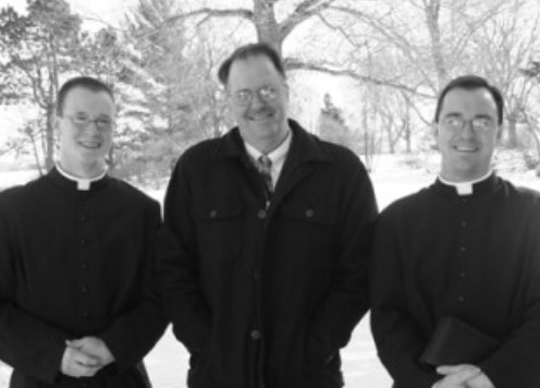 Fr. Matthew Stafki (left) with his father (center) and his brother, Fr. Mark Stafki.