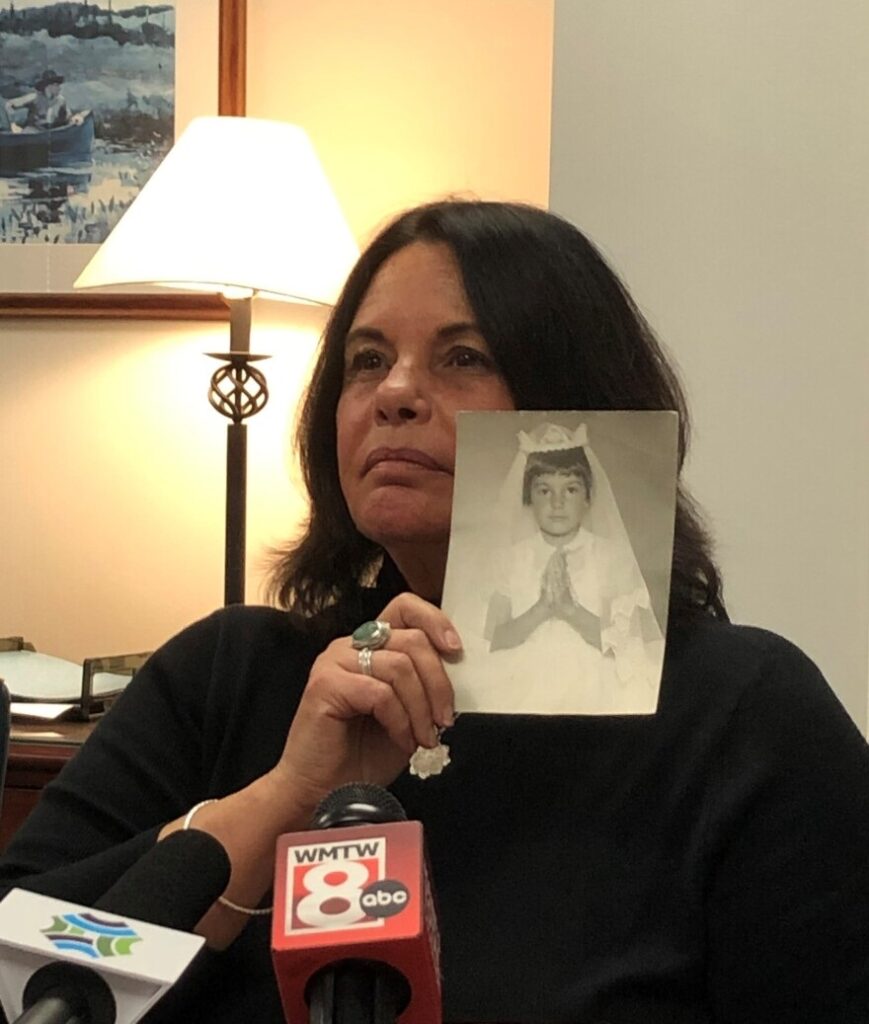 Ann Allen holds her first communion photo.