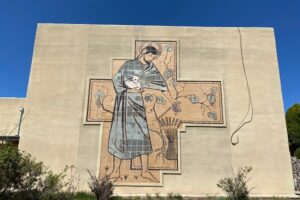 A mural decorates a building once part of the now defunct clergy treatment center operated by the Servants of the Paraclete in Jemez Springs, New Mexico. The men's religious order will help fund a $121.5 settlement between the Santa Fe Archdiocese and claimants in sexual abuse cases. (NCR photo/Elizabeth Hardin-Burrola)