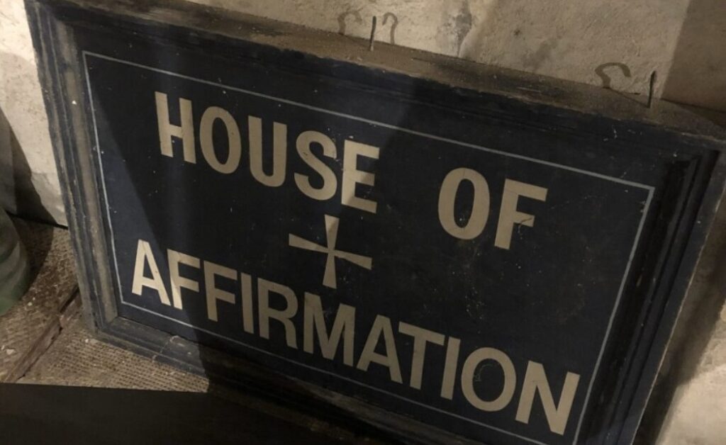 The House of Affirmation in Whitinsville, Massachusetts, was a treatment center for pedophile priests run by the Worcester Diocese, where teenage boys were allegedly abused in the mid-1970s. The sign was photographed in May 2022 in the basement of the building which once housed the center. Terence McKiernan / BishopAccountability.org