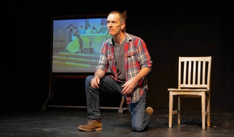 Jay Sefton in a scene from his one-man play “Unreconciled.” The production, at CitySpace in Easthampton, examines abuse he suffered as a teen by a Catholic priest while working on a school play and his effort to come to terms with it as an adult. Image courtesy Chester Theatre Company