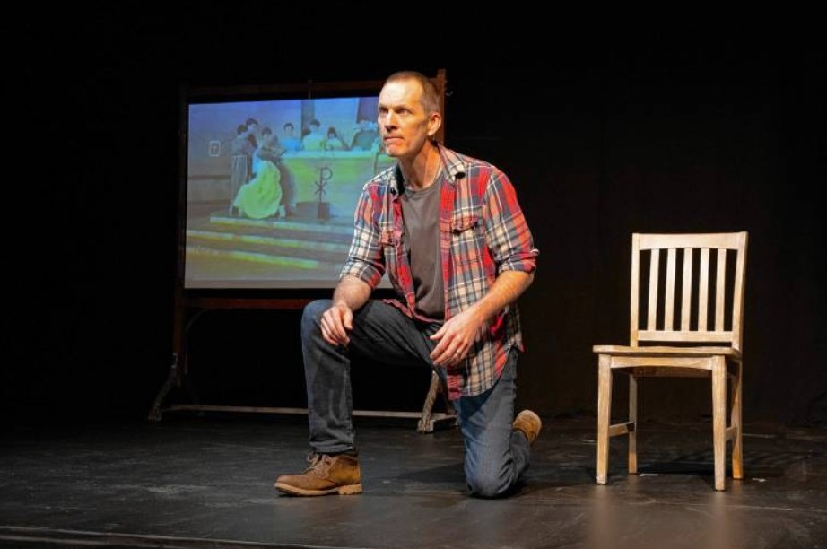 Jay Sefton in a scene from his one-man play “Unreconciled.” The production, at CitySpace in Easthampton, examines abuse he suffered as a teen by a Catholic priest while working on a school play and his effort to come to terms with it as an adult. Image courtesy Chester Theatre Company