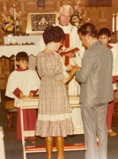 Monsignor Richard Hiester presides as Michael's parents renew their wedding vows. Michael, left, served as an altar boy in the ceremony. Credit: Courtesy of Michael Stano