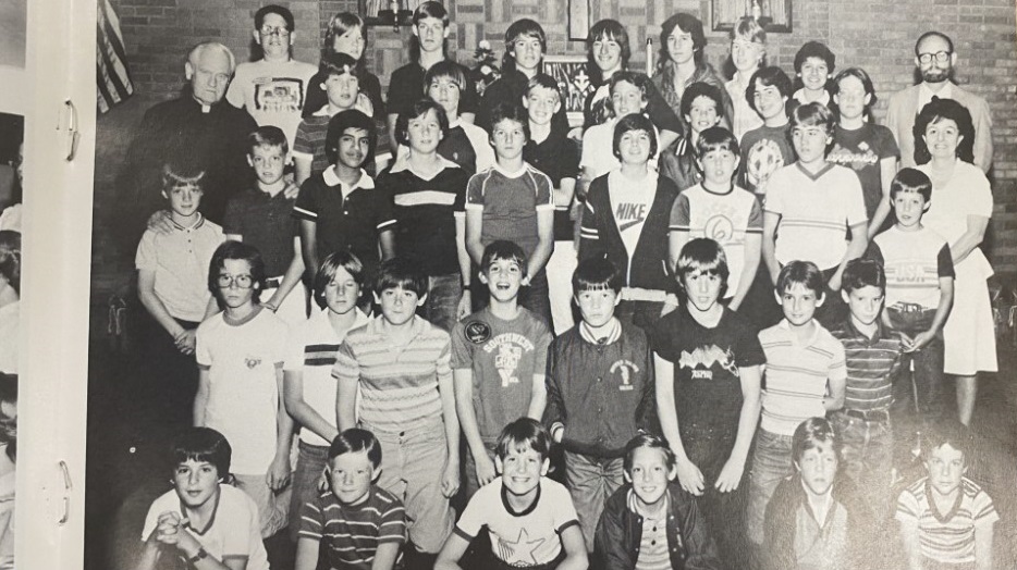 Michael Stano, lower left, during his time as an altar boy at Notre Dame Catholic Church in Denver. Monsignor Richard Hiester is on the left. Credit: Courtesy of Michael Stano