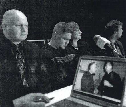 Gregory Ford, sitting between his father, Rodney, and mother, Paula, bows his head as his family and their lawyers detail his abuse by the Rev. Paul R. Shanley. On the computer is a photo of Shanley (right) and Cardinal Bernard F. Law. (Globe Staff Photo / Jonathan Wiggs)