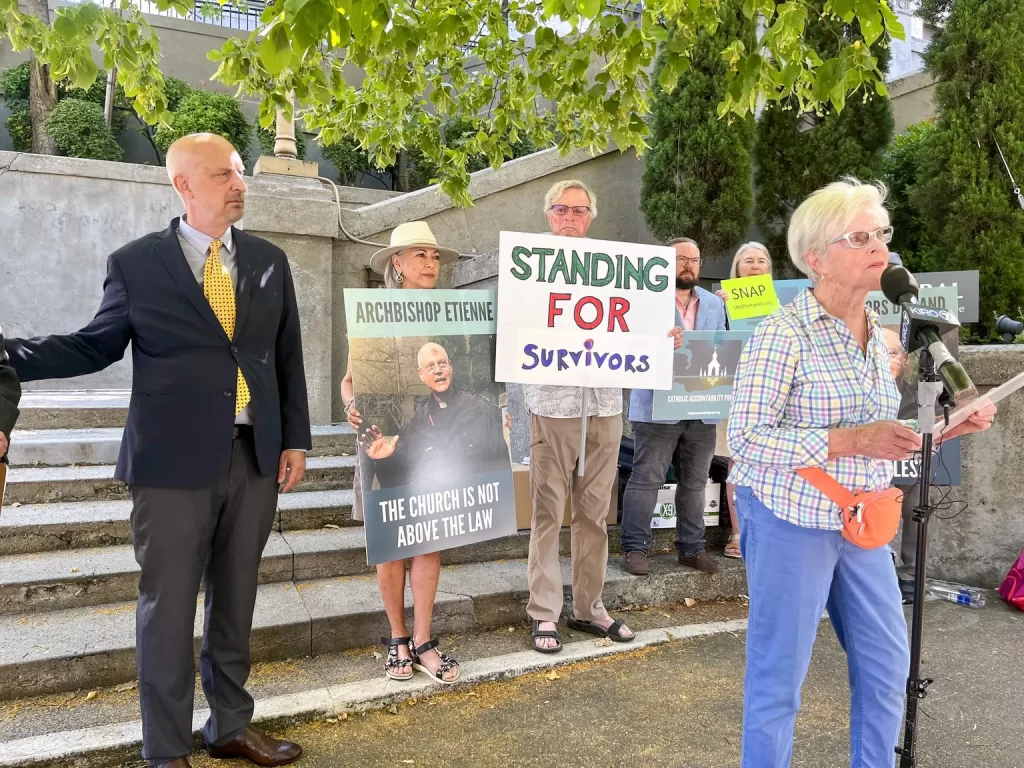 All of us are mandated reporters when it comes to crimes against children, writes the author, Mary Dispenza, pictured speaking in front of St. James Cathedral in Seattle. (Catalina Gaitán / The Seattle Times, 2024)