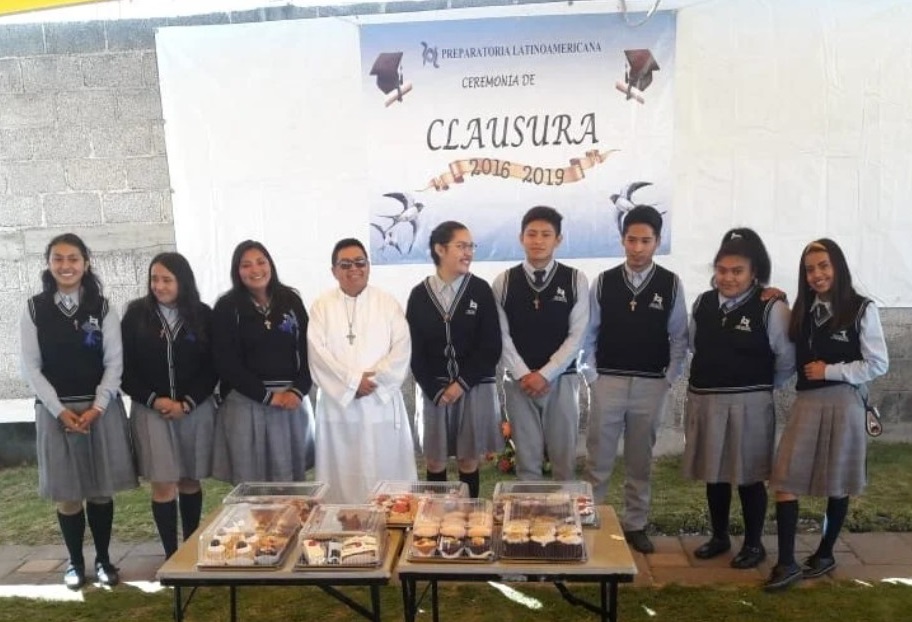 Flores Martínez, at center in white, with minors during a party in Tlaxcala, Mexico, before the pandemic, 2019.