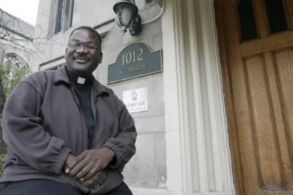 The Rev. Freddy Washington, shown outside a South Side parish in a photo taken for a 2009 article in a Catholic church publication.]