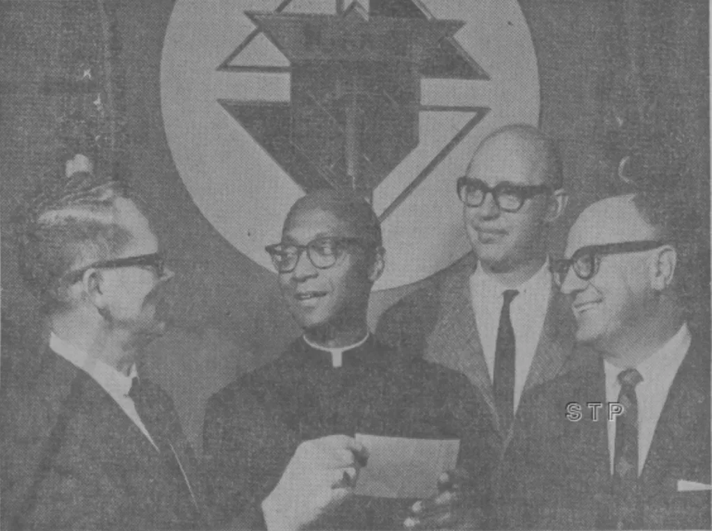 Fr Herman A. Porter, center, with members of the Bishop Muldoon Council of the Knights of Columbus at a ceremony honoring him in May 1964. (The Observer, Diocese of Rockford)