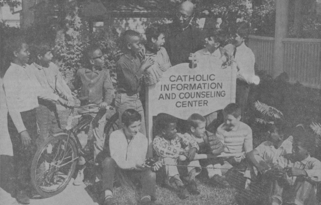 Fr Herman A. Porter with children at the Catholic Information and Counseling Center in Rockford in June 1964. (Herzog Photo/The Observer, Diocese of Rockford)