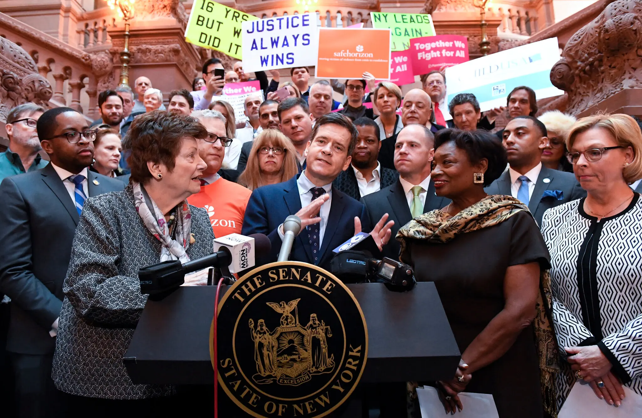 Ms. Markey in 2019 at a rally outside the State Capitol in Albany in support of the Child Victims Act. She appeared alongside State Senator Brad Hoylman-Sigal, Democrat of Manhattan, and Andrea Stewart-Cousins, second from right, the Senate majority leader and Democrat of Yonkers.Credit...Hans Pennink/Associated Press