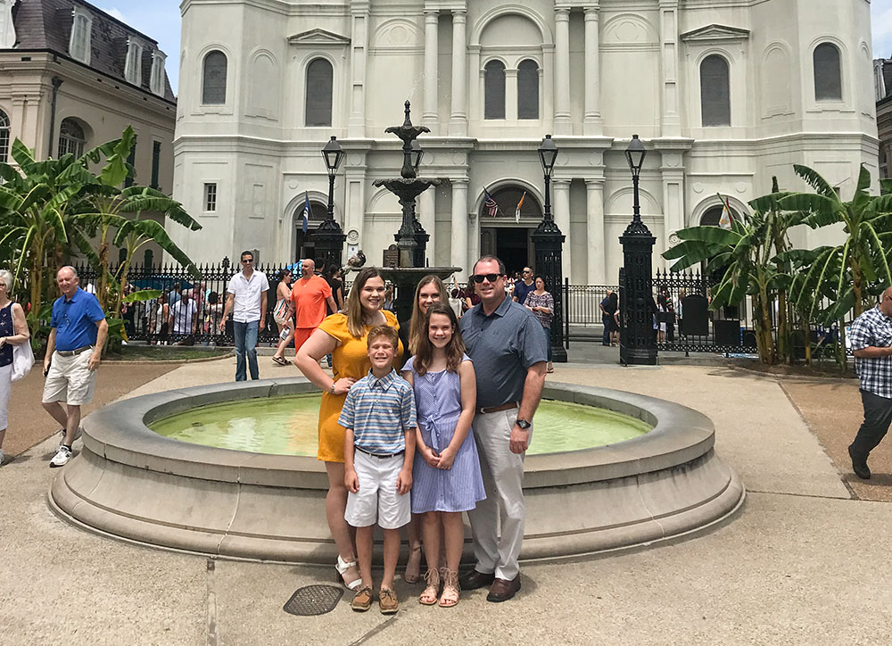 James Adams and his children pose for a photo outside St. Louis Cathedral in New Orleans after Sunday Mass in April 2019. (Courtesy of James Adams