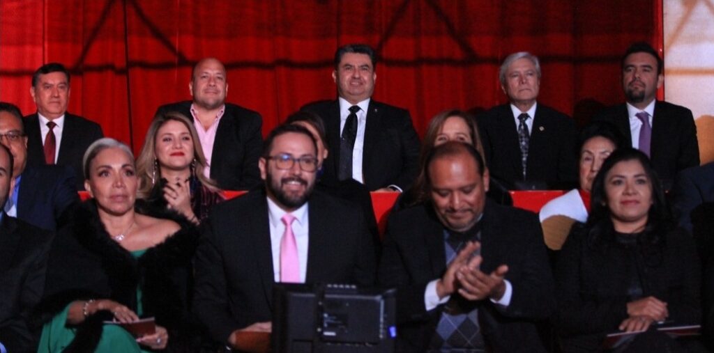 On the top row: The then-governor of Jalisco, Enrique Alfaro (without tie); Naasón Joaquín García (with a black tie); and then-governor of Baja California, Jaime Bonilla, celebrate Naasón's anniversary as leader of the Luz del Mundo Church. Social media of Movimiento Ciudadano, December 14, 2018. @ www.flickr.com/photos/137480931@N04/45608055114.
