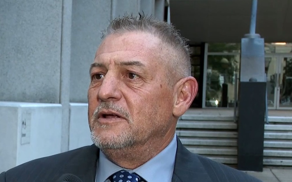 Brian Mannix, a survivor of childhood abuse by George Brignac, speaks outside bankruptcy court in New Orleans on Tuesday, December 2, 2025. Screen image from video report.