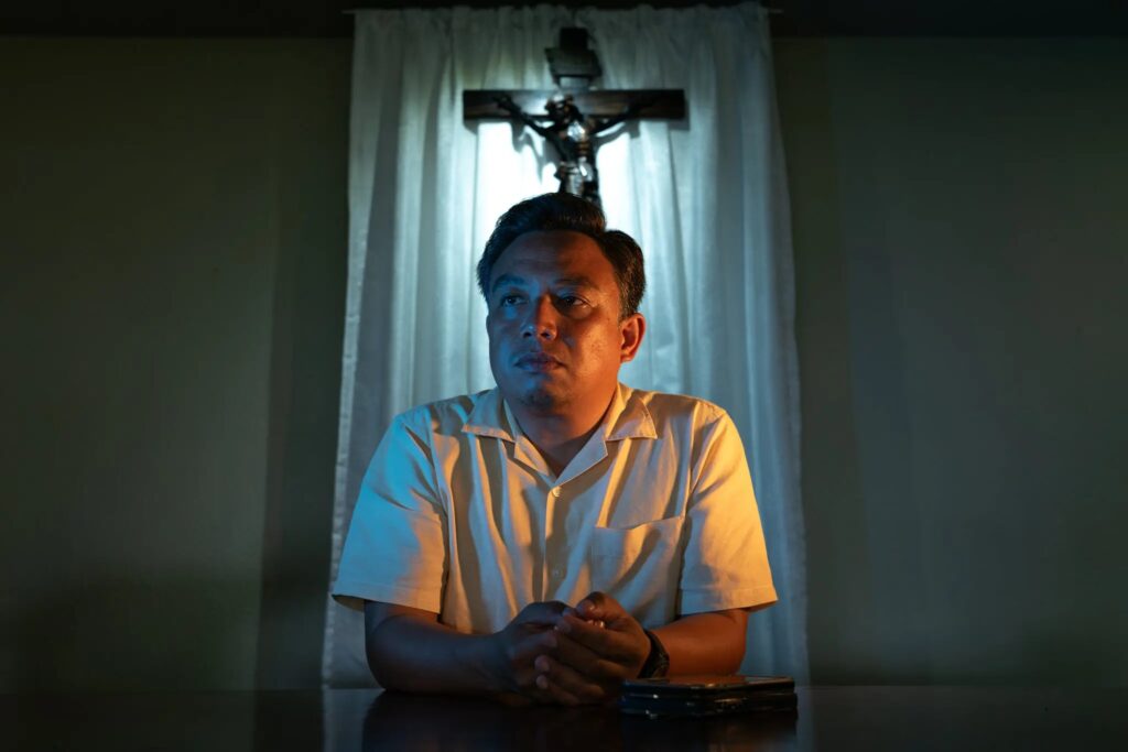 Michal Gatchalian last year in front of a makeshift altar he had setup at his suburban village’s clubhouse. He no longer goes to the church where he was an altar boy.