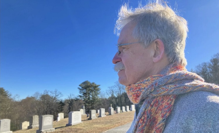 Terry McKiernan, president of BishopAccountability.org, visits a cemetery in Douglas where Phil Saviano is buried. Saviano was a board member of BishopAccountability.org and a survivor of child sex abuse by clergy in the Worcester Diocese.