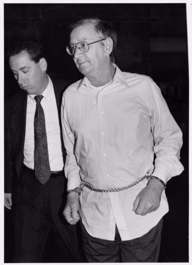 James R Porter left the State Police barracks in Middleborough on his way to the New Bedford Superior Court. - Yungi Kim